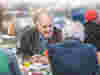 Two older men enjoying a conversation at a community lunch club run by Royal Voluntary Service Volunteers 