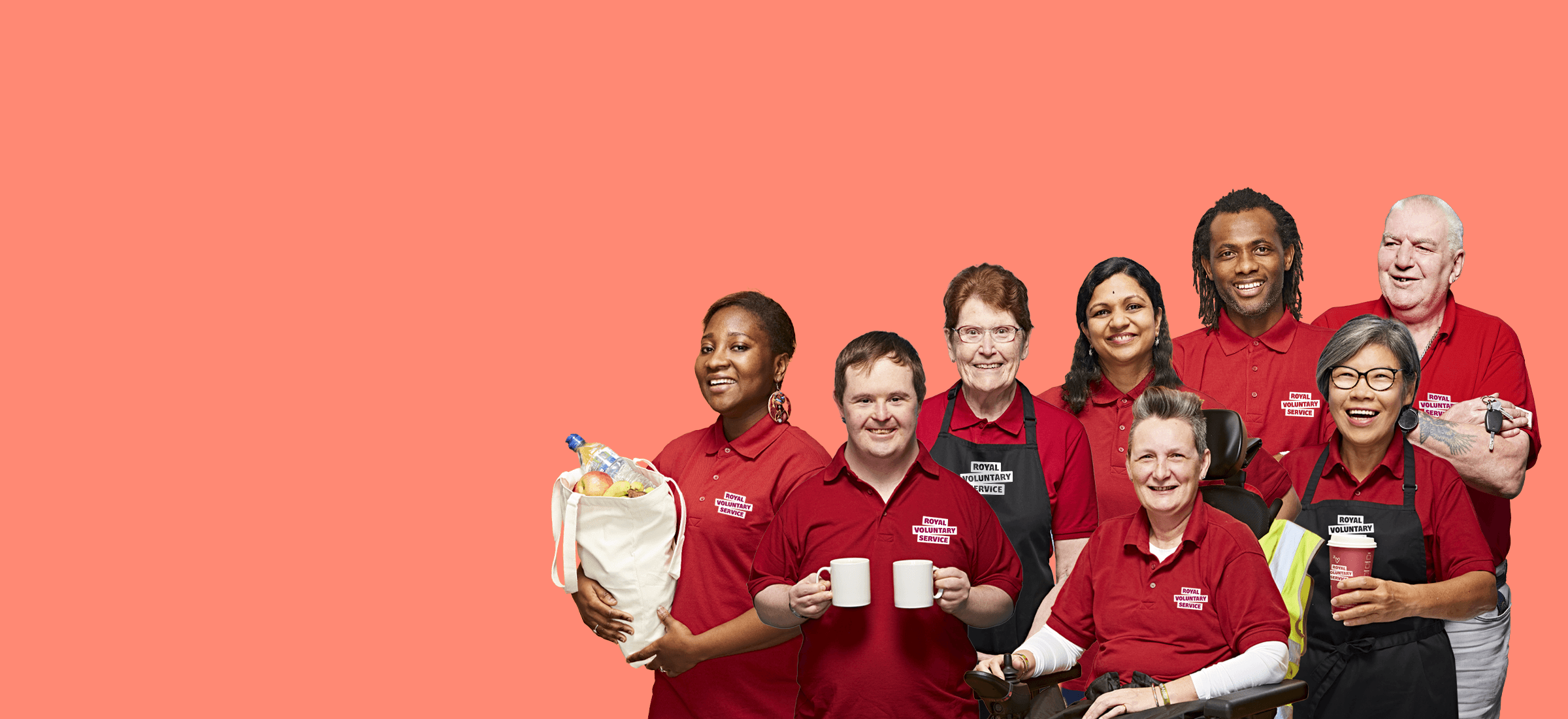 A diverse group of Royal Voluntary Service volunteers wearing branding work wear against an orange backdrop 