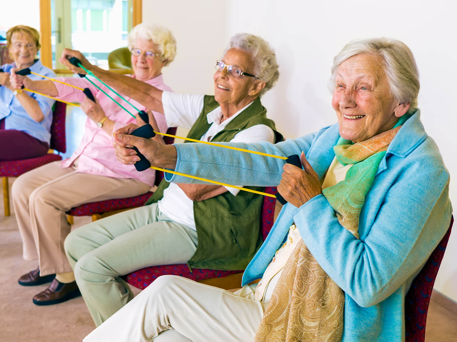 A group of older people exercising at the Hanley Centre