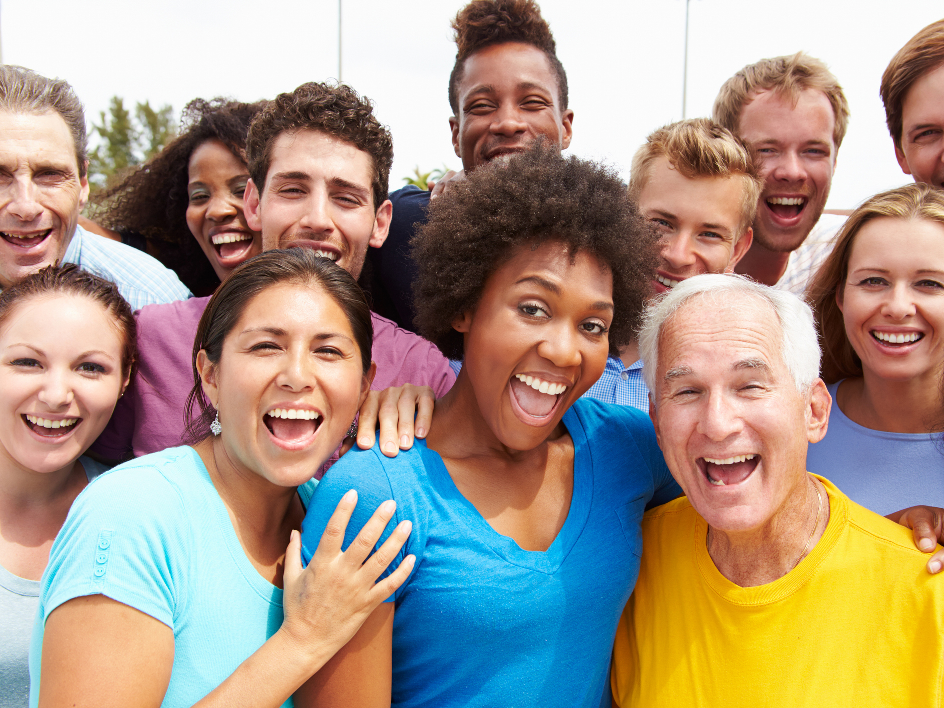 A group of smiling and happy people at a fundraising event 